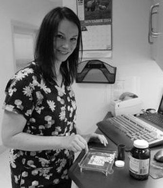 Black and White image of a young woman counting medication in the laboratory